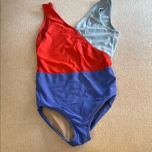 Bold Red and Blue Color-Block Leo with Geometric Design